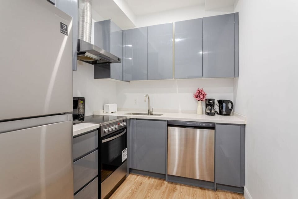 Modern kitchen with sleek cabinetry, stainless steel appliances, and all the essentials for easy cooking