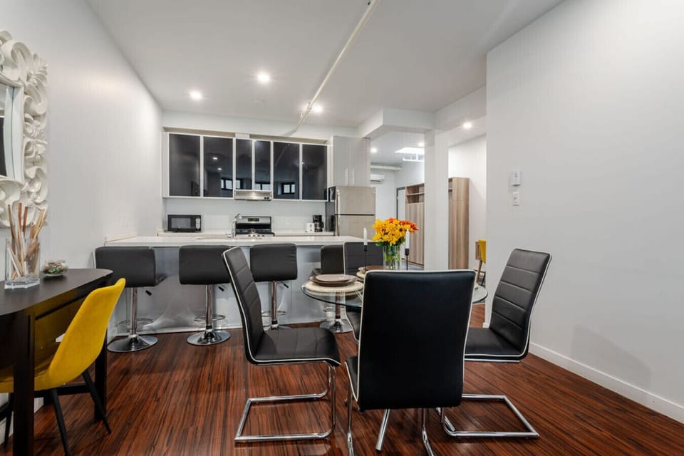 Modern dining space with sleek seating and a smooth transition to the fully equipped kitchen
