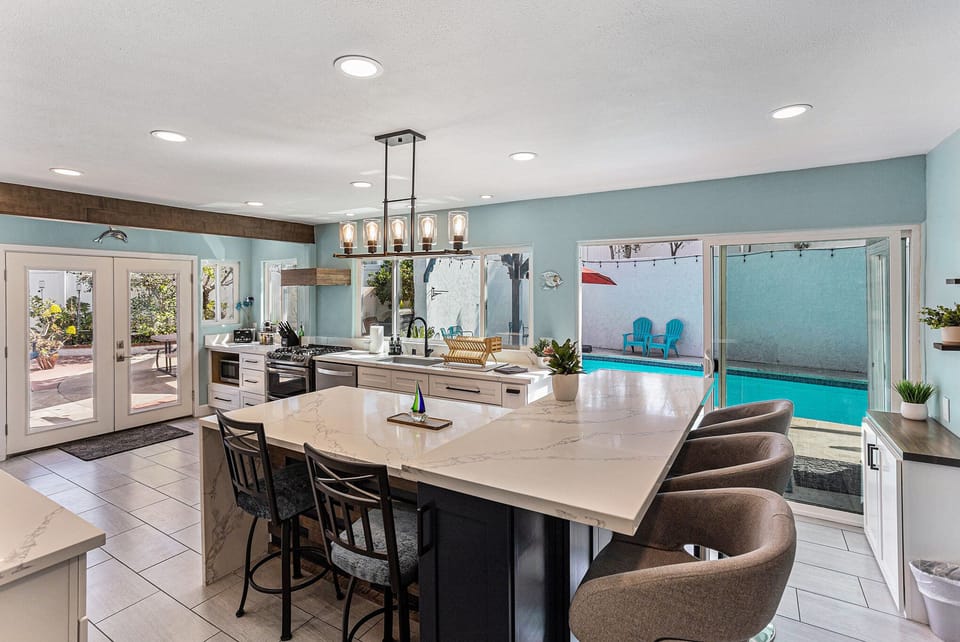 Modern kitchen with plenty of countertop space & bar seating.