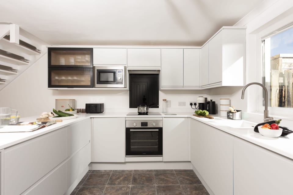 Poldreth, Porthtowan. Ground floor: Including an electric oven and hob, fridge/freezer, microwave, dishwasher, coffee machine and wine fridge