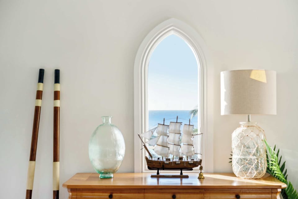 The home has been professionally styled with a mix of coastal and modern elements    