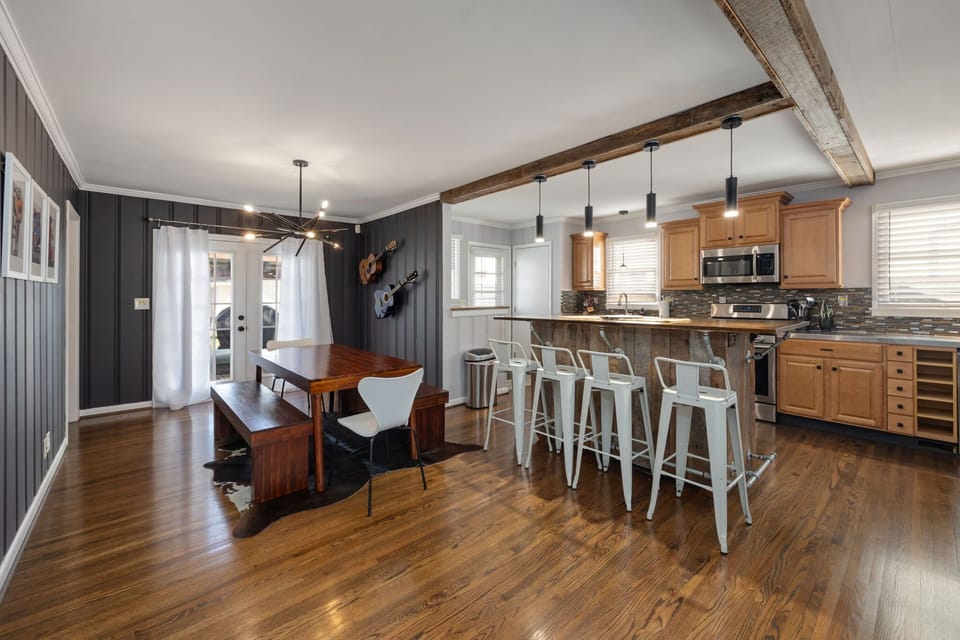 Modern design meets rustic charm—gather around the stylish island for unforgettable meals!