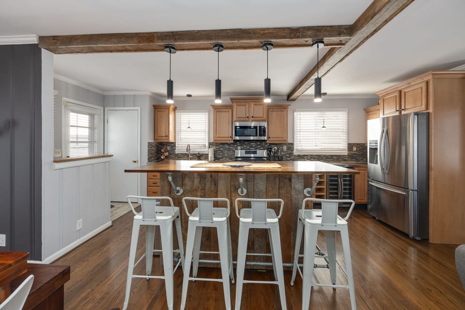 Modern design meets rustic charm—gather around the stylish island for unforgettable meals!