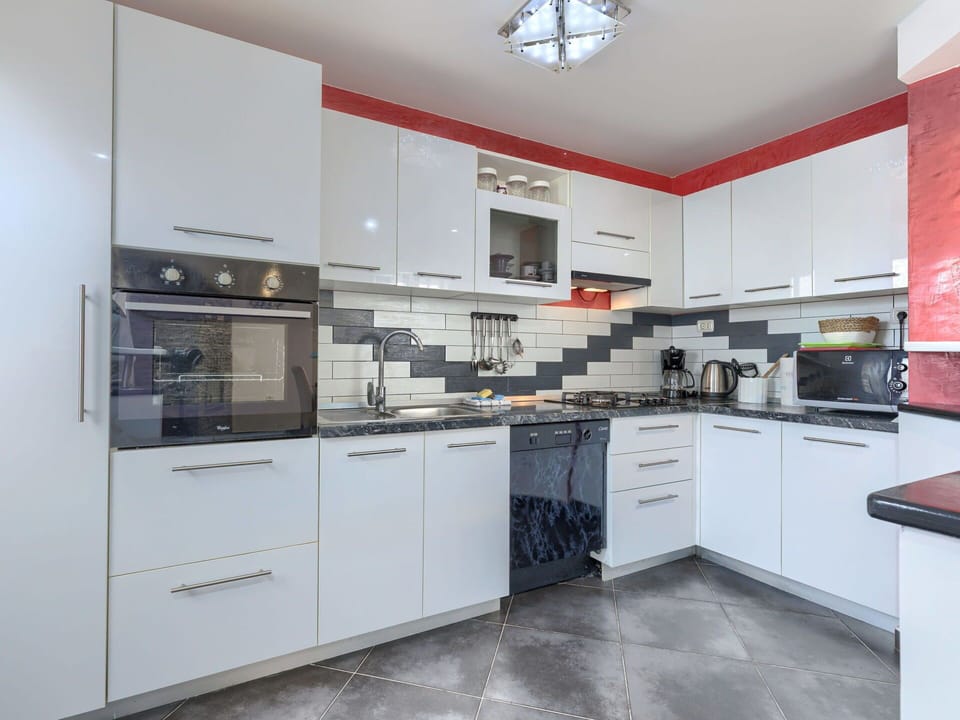 Kitchen, Kitchen Appliance, Countertop, Major Appliance, Cabinetry, Kitchen Stove, Flooring, Interior Design, Stove, Floor