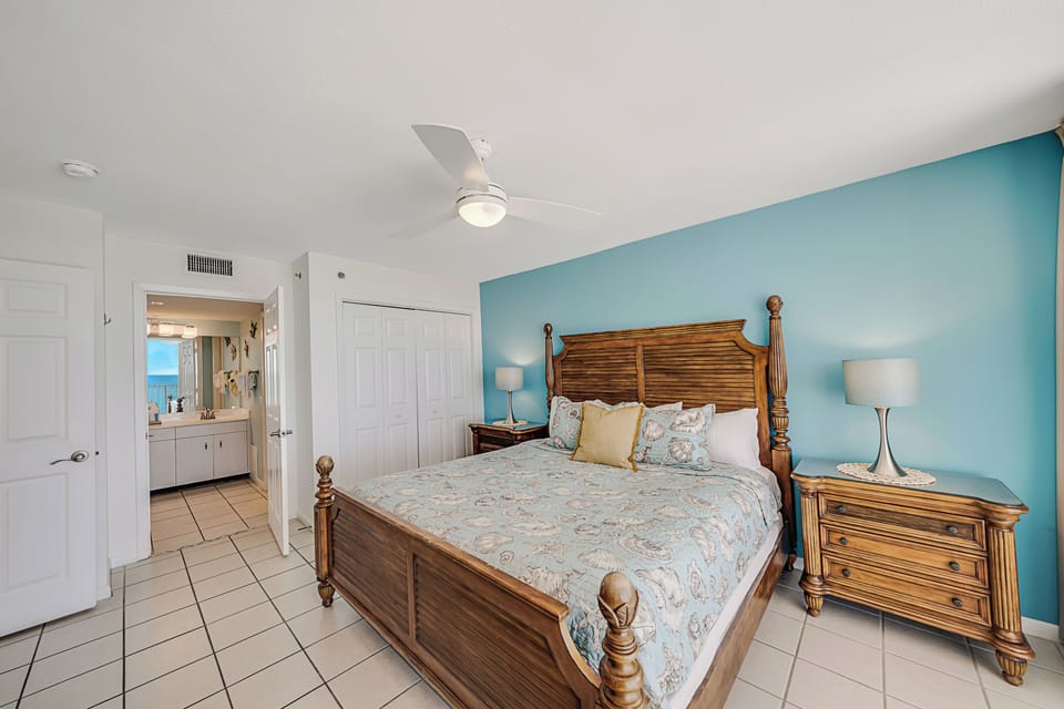 The gulf front master bedroom features a King bed, a television, and an ensuite bathroom.