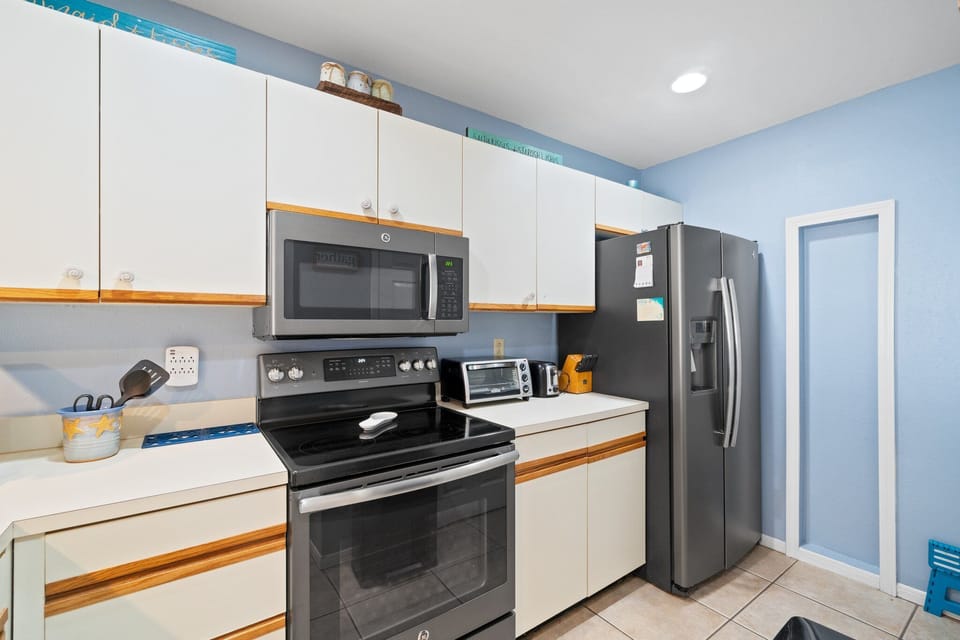 Modern kitchen with stainless steel appliances and ample cabinet space