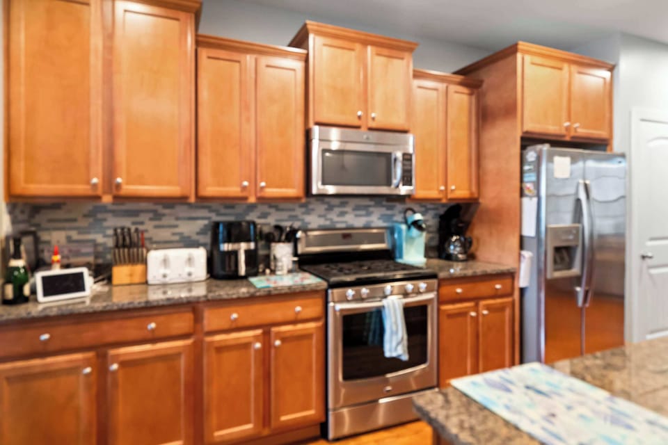 The kitchen offers ample storage space & all the comforts of home