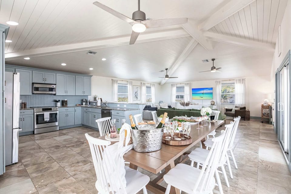 Large kitchen comes fully stocked and large enough for people to gather to to prepare and enjoy fabulous meals with family and friends.
