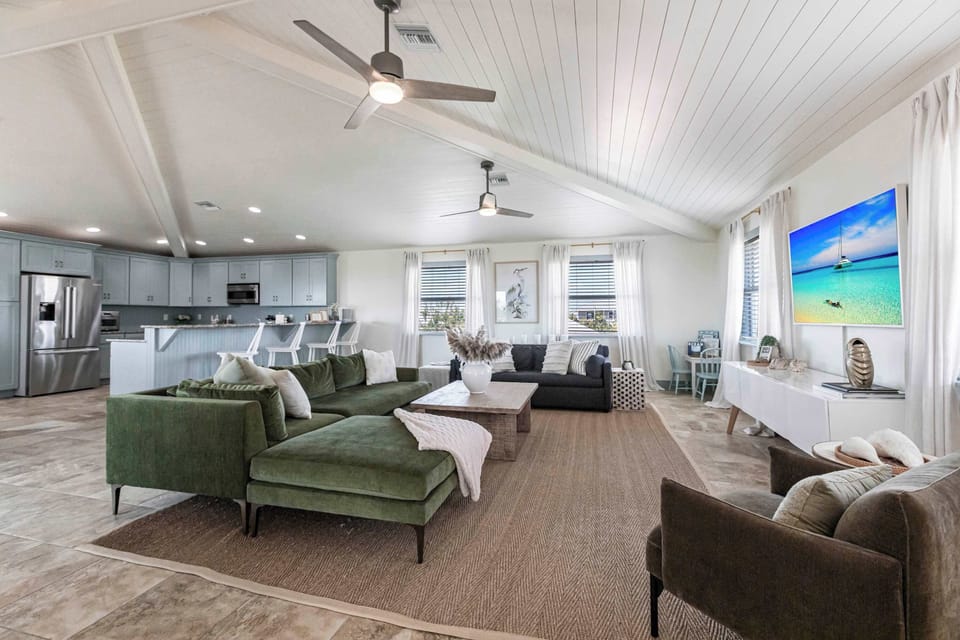 There is a seamless flow from the large living area to the kitchen. 