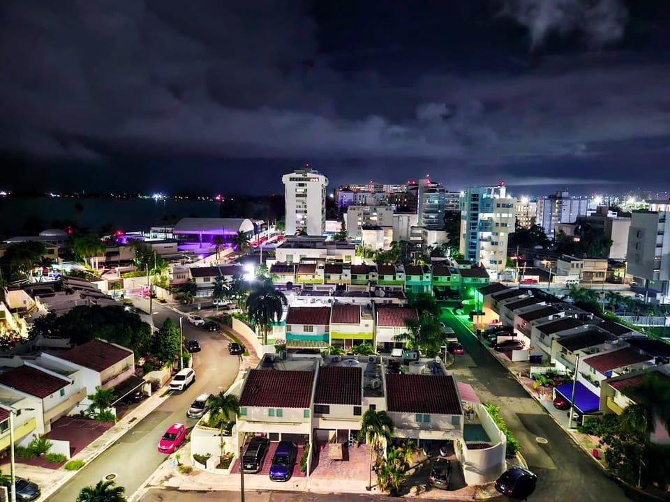 Breathtaking night view from your balcony overlooking Isla Verde’s lively cityscape—perfect for enjoying the island’s vibrant nightlife from the comfort of your stay.