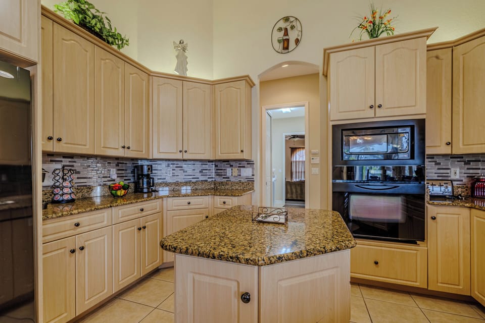 - Fully equipped kitchen features granite countertops, modern appliances, and extra cabinet space
- Center island offers extra prep space for cooking and entertaining
- Bright, functional layout perfect for home cooked meals and gatherings