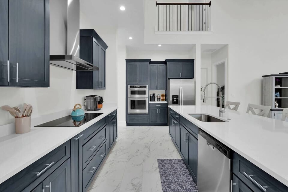 Spacious kitchen with double ovens and island—great for cooking together.
