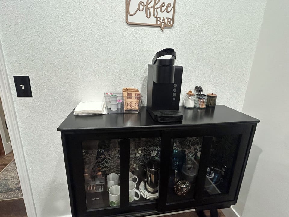 Coffee bar with Keireg  &variety of pods, tea kettle & French press and snacks.