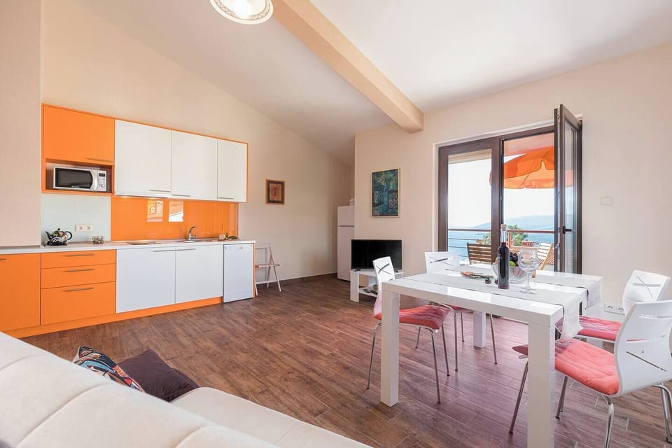 Living room (kitchen, TV, dining table)