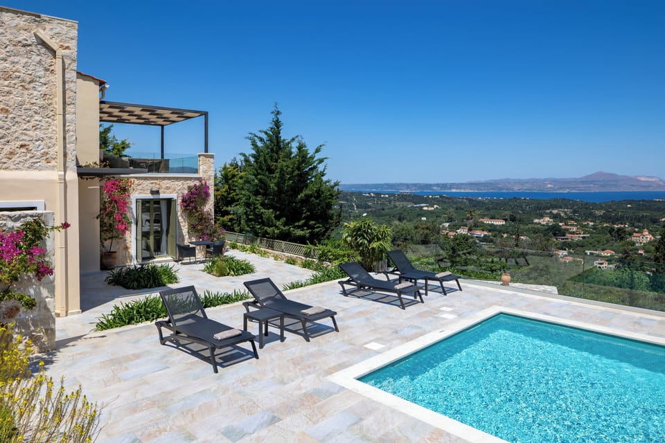 Private pool with sea and hill views and access to outdoor lounge and kitchen