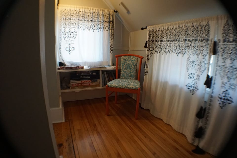 Sitting area at the top of the stairs in the second bedroom.