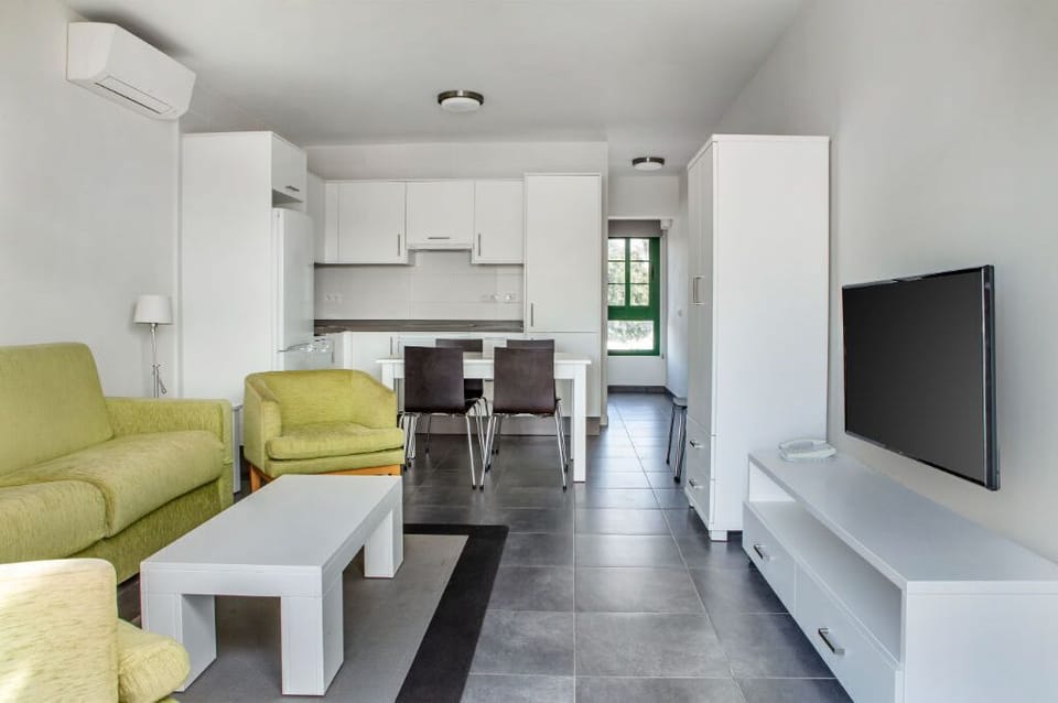 Step into a sleek, fully-equipped kitchen to whip up delectable meals with ease.