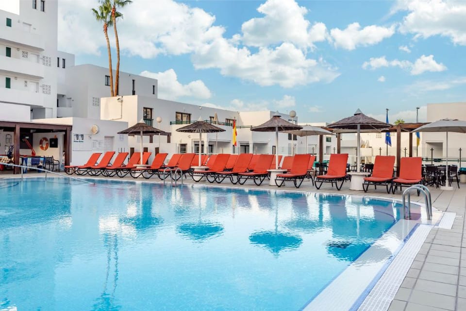 The essence of vacation captured by the pool, surrounded by scenic views and a laid-back atmosphere.