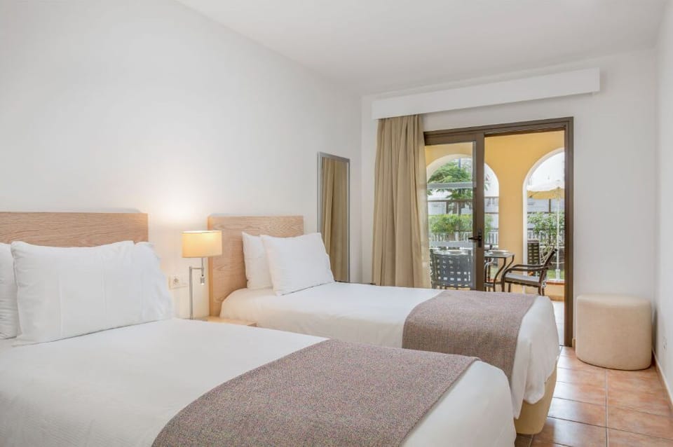 Retreat to this minimalist bedroom with a focus on comfort and serenity.