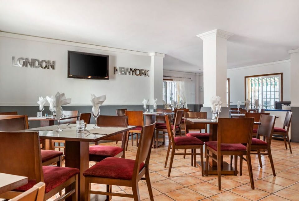 Spacious dining hall with a warm ambiance for enjoyable group meals.