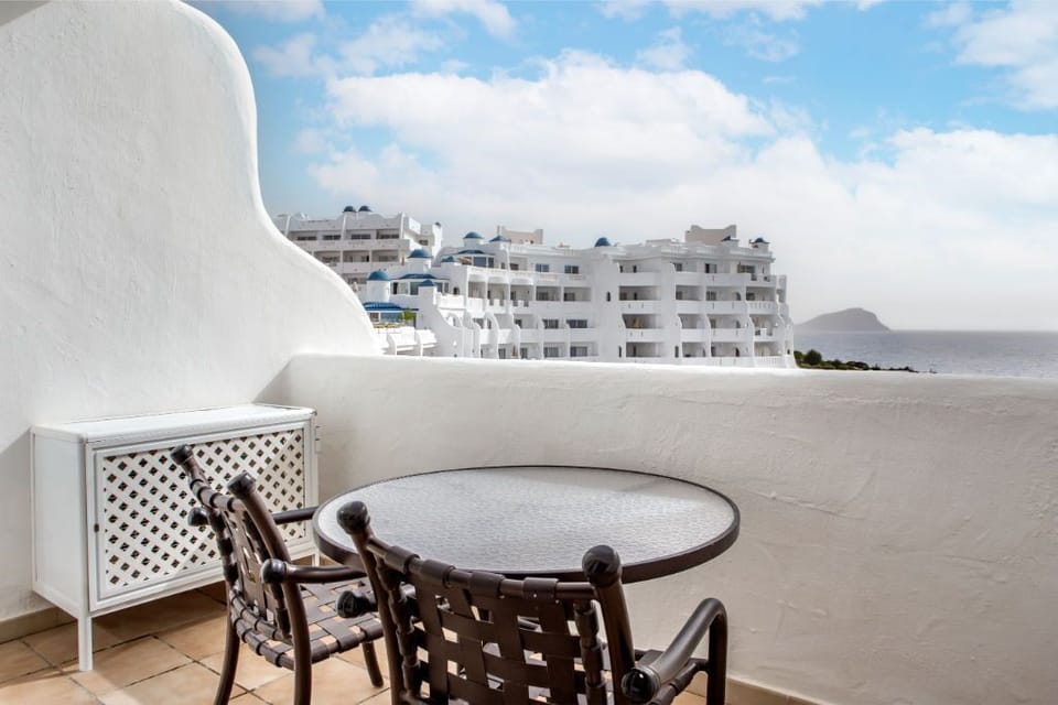Private balcony with seating, offering a secluded spot to enjoy the panoramic views.
