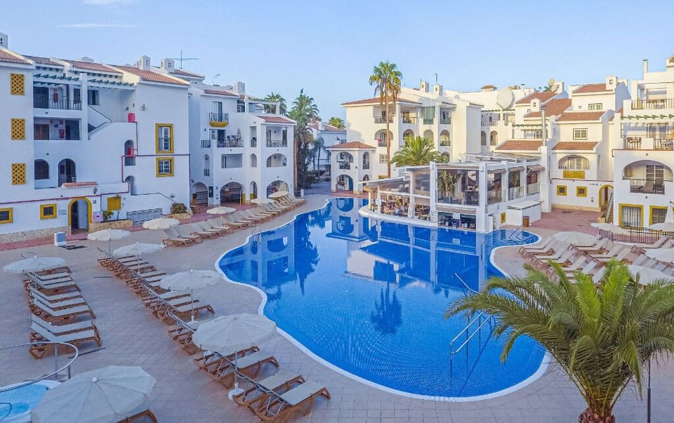 Your perfect pool view surrounded by white-washed villas.