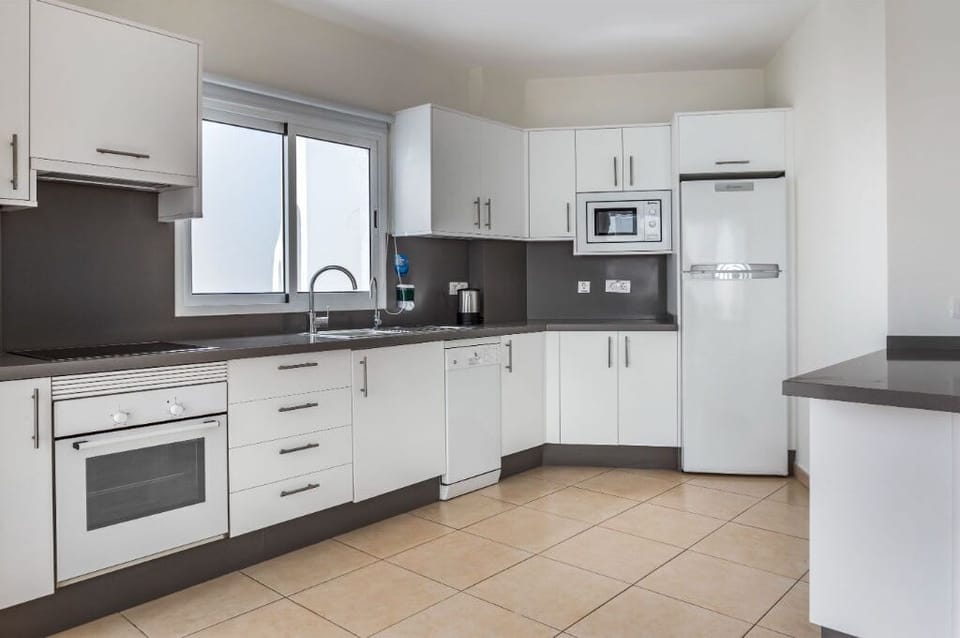 Streamlined kitchen space, complete with modern amenities for convenient meal prep.