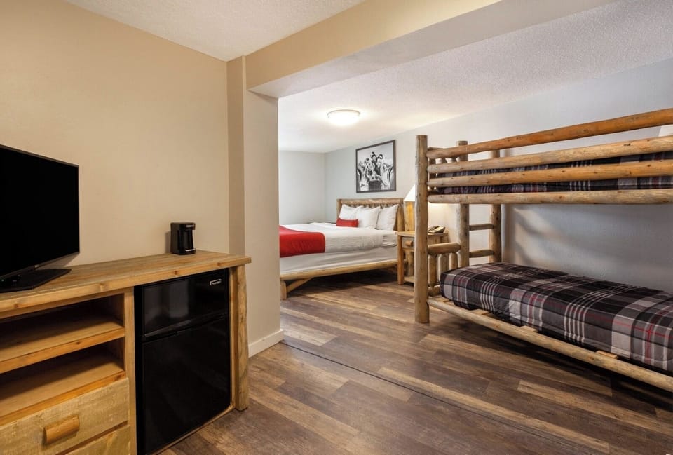 Unwind in a cozy bunk-and-queen room with mini-fridge.