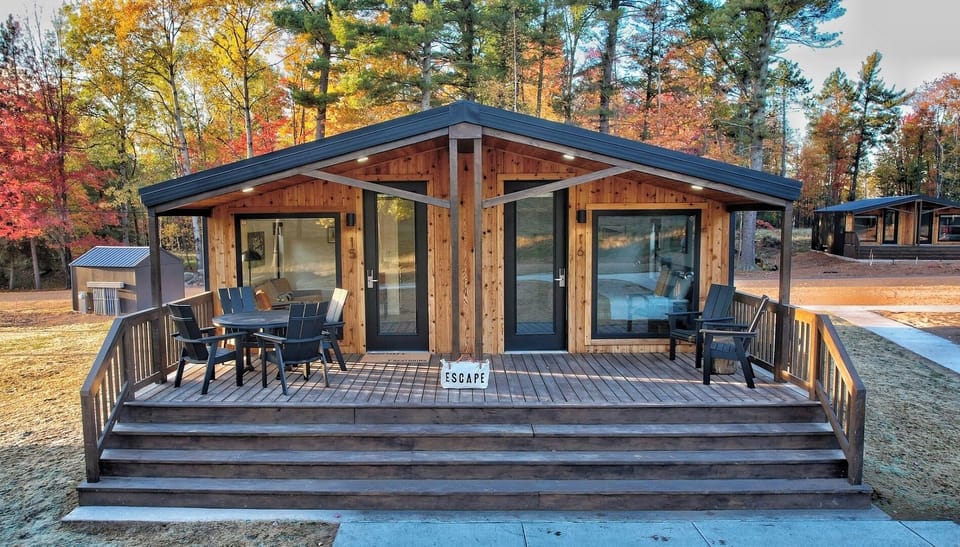 Arrive to a cozy cabin retreat framed by autumn color.
