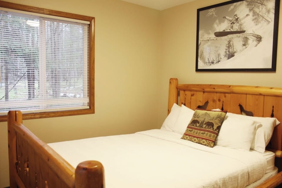 Sink into crisp linens and relax in warm, cabin-style serenity.