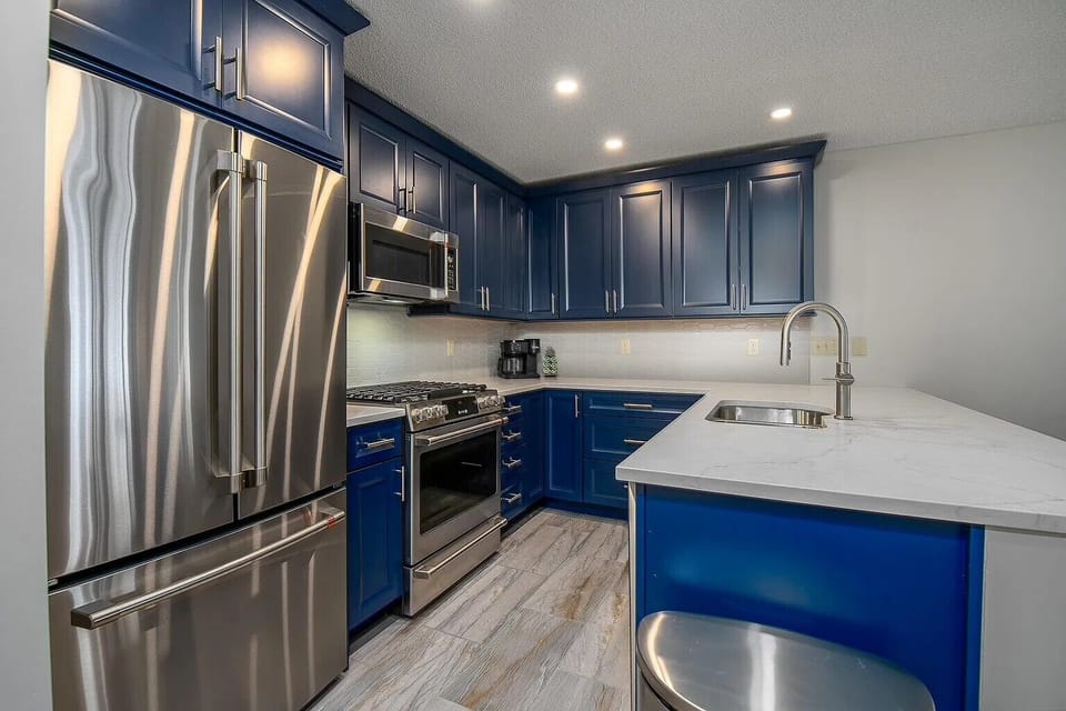 Kitchen with GE Cafe Appliances, Bosch Dishwasher, Double Sink, Keurig Coffee