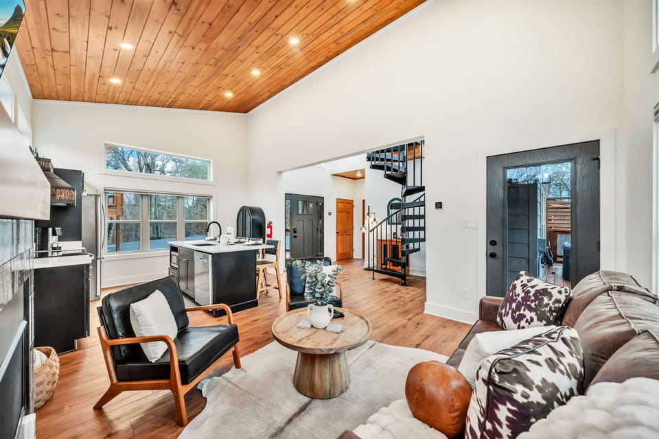 Open concept living area, featuring modern decor, perfect for family gatherings.