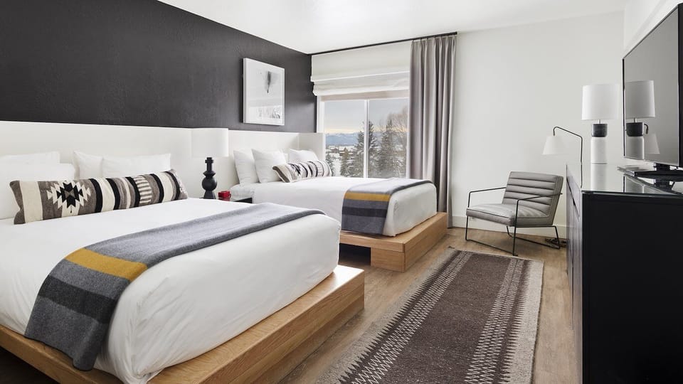 Spread out comfortably with two beds and calming, mountain-inspired decor.