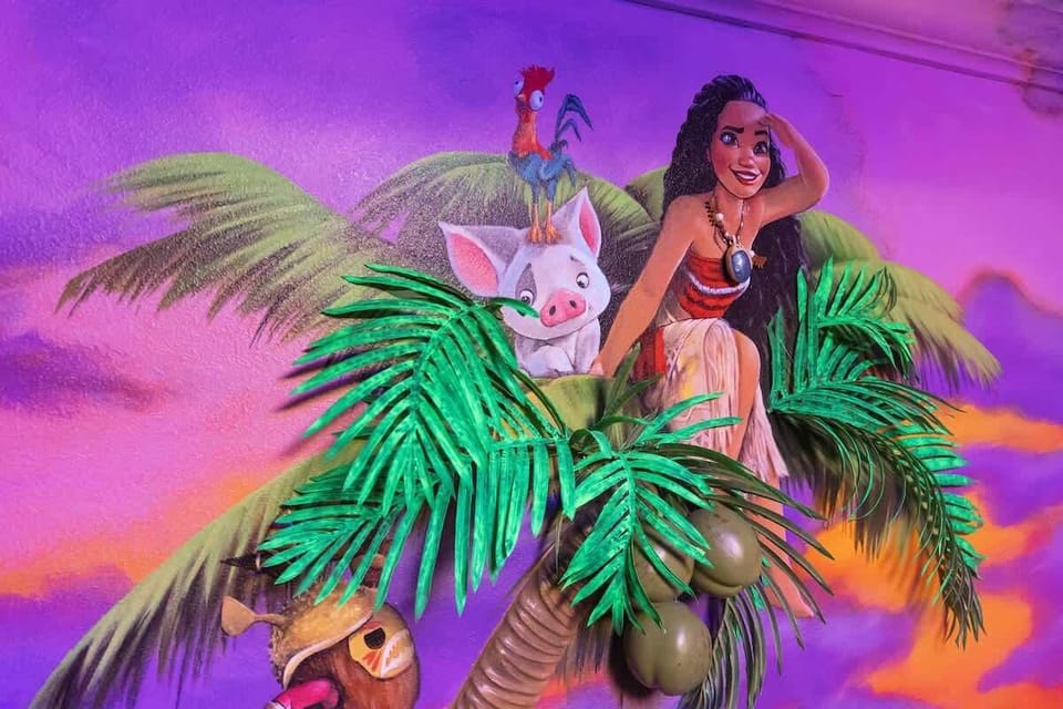 Vibrant Moana-themed mural brings Disney magic to life. Stunning hand-painted sunset scene features beloved characters amidst lush tropical foliage. Moana, Pua, and Heihei pop against vivid purple sky. LED effects create immersive island atmosphere.