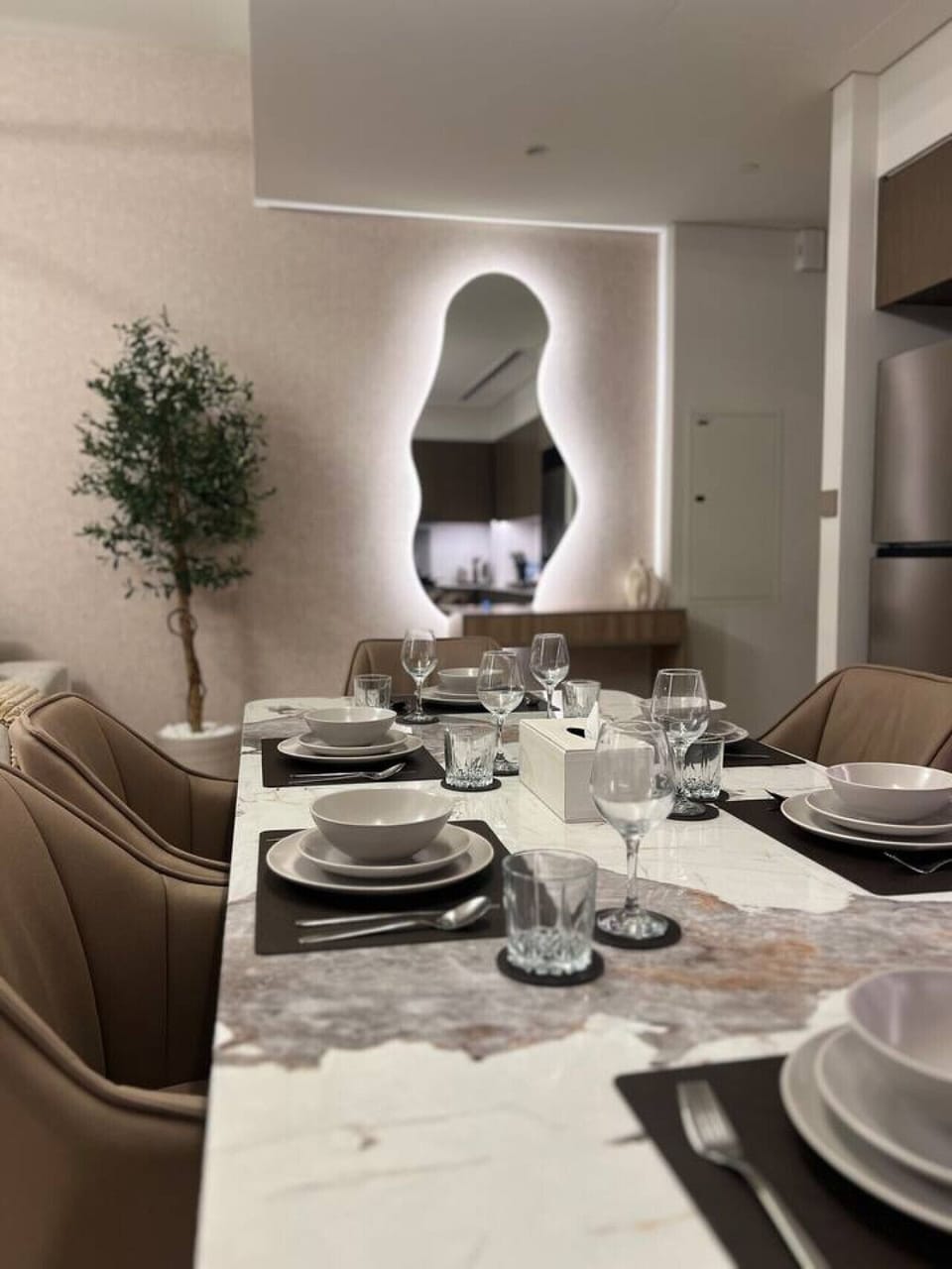 Enjoy a memorable meal at the elegant dining table, set in a spacious, modern dining area. Perfect for family gatherings or intimate dinners, this stylish space adds a touch of luxury to your stay in Downtown Dubai.