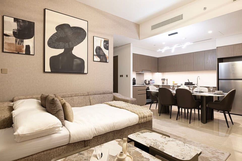 Enjoy the versatile living space featuring a comfortable sofa bed and an elegant dining area. Perfect for relaxing and entertaining, this modern setup offers both convenience and style in Downtown Dubai.