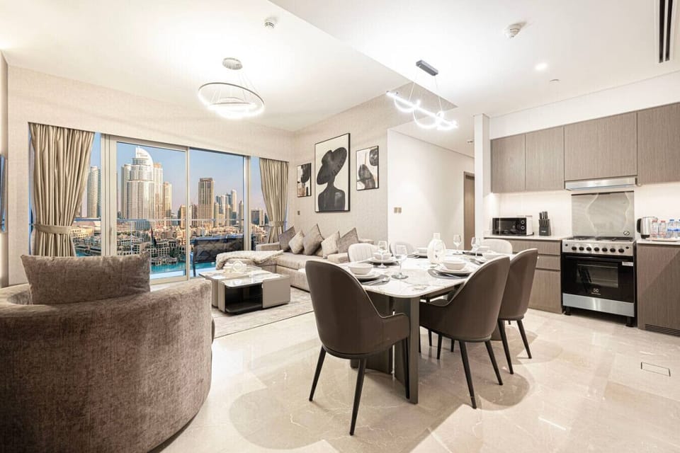Experience seamless living with a stylish dining area integrated into the modern living room. This open-plan space offers comfort and elegance, perfect for relaxing and dining during your luxury stay in Downtown Dubai.