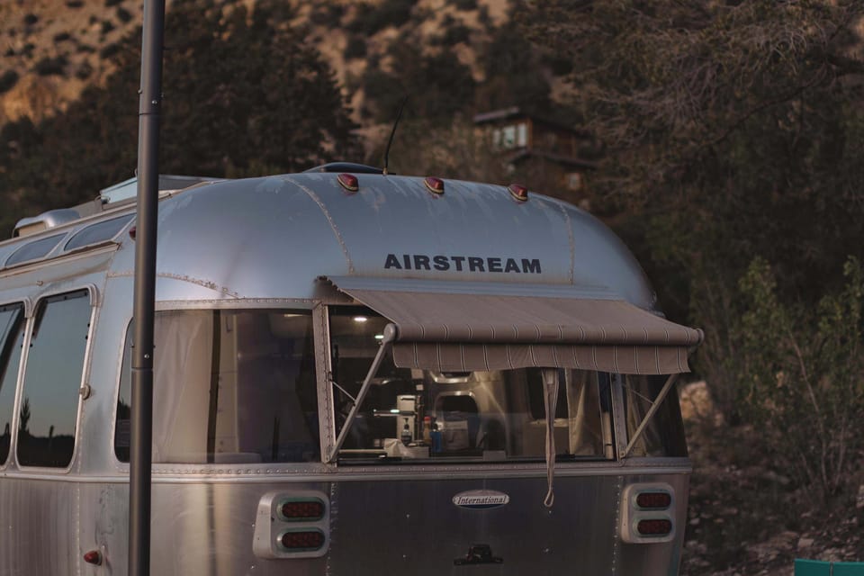 Vintage Airstream charm at East Zion Resort, surrounded by peaceful Southern Utah scenery near Zion National Park and Bryce Canyon.