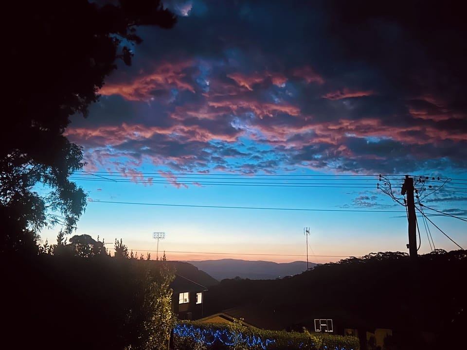 As evening falls, watch the sky transform in a golden glow.