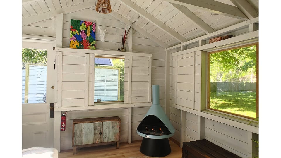 A cozy sanctuary wrapped in the quiet of nature.