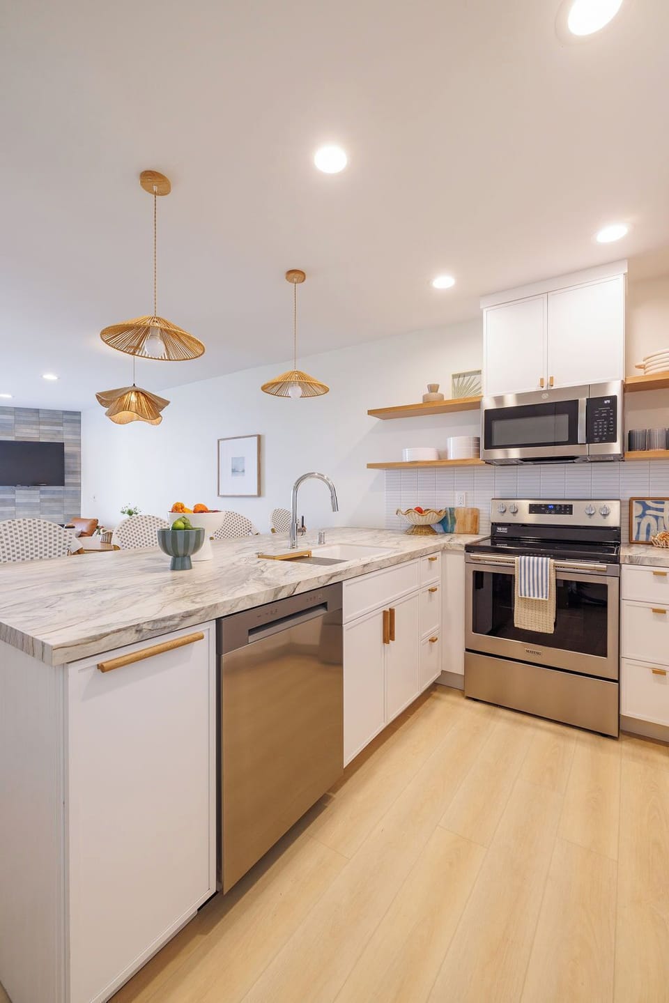 Custom countertops, personalized tile backsplash, and stunning white cabinets
