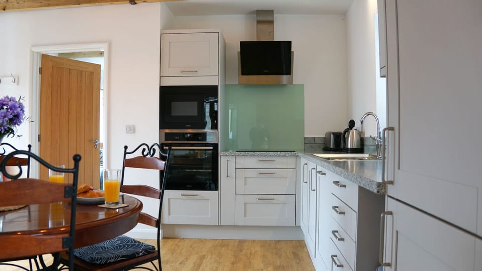 Fully Equipped kitchen with integrated microwave and oven