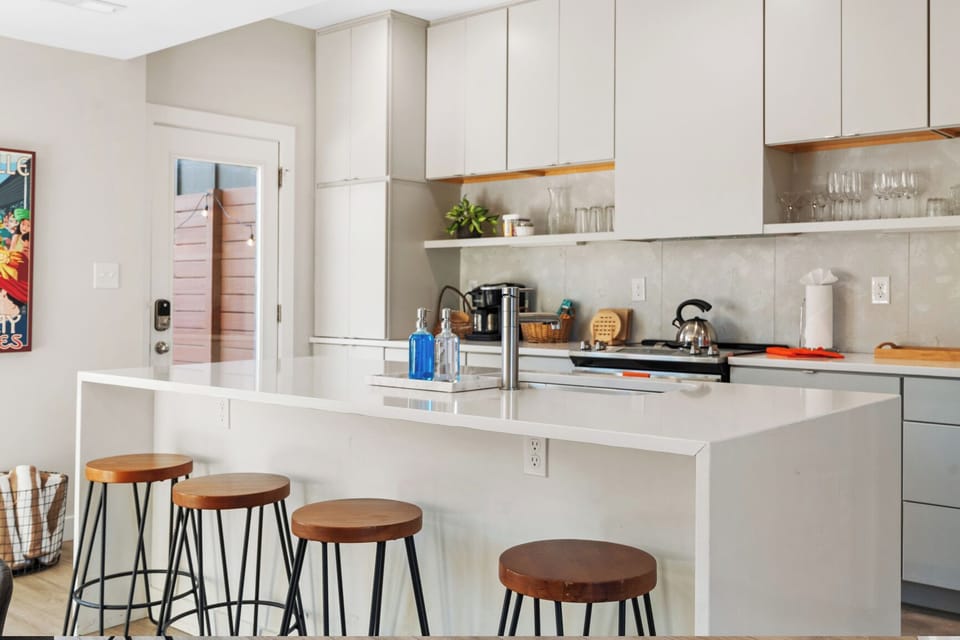 A bright and modern kitchen designed for cooking and gathering together.