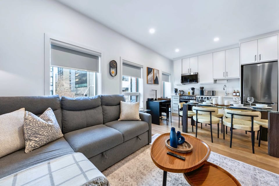 Open living and dining area with bright natural light.