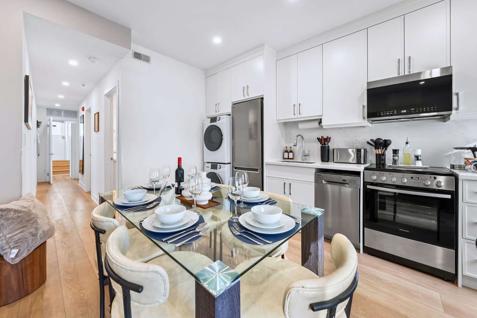 Kitchen equipped with integrated laundry and functional layout.
