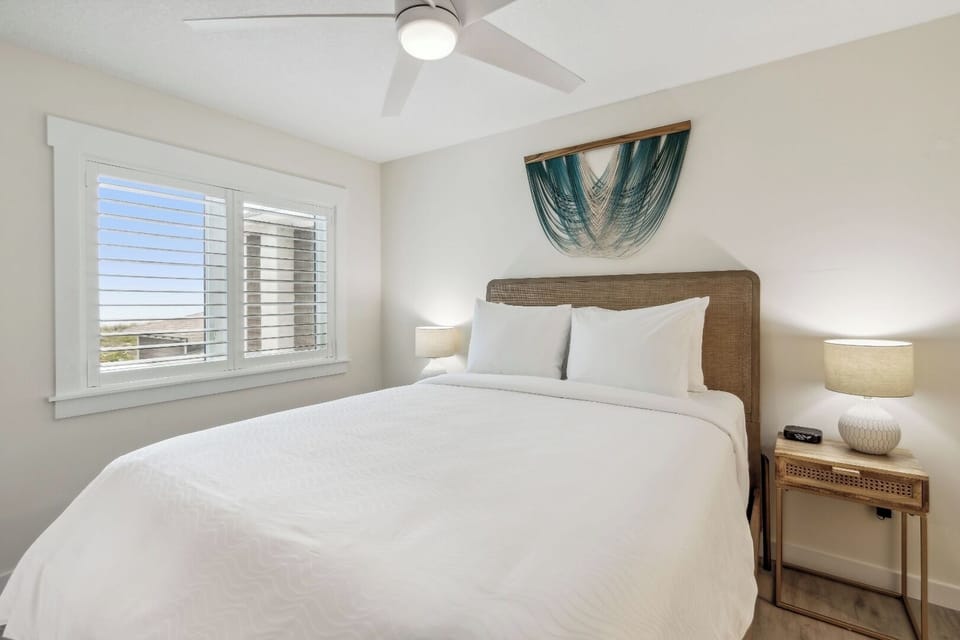 Wake up refreshed in a sunlit bedroom with coastal charm.