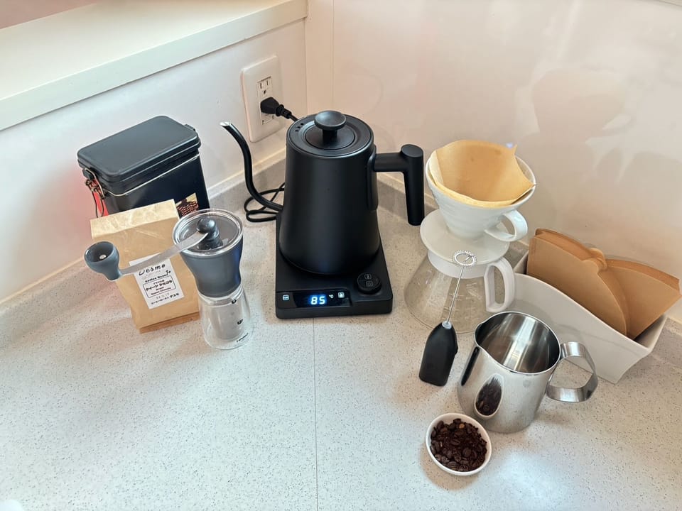 Coffee station including milk frother, temperature adjustable electric kettle