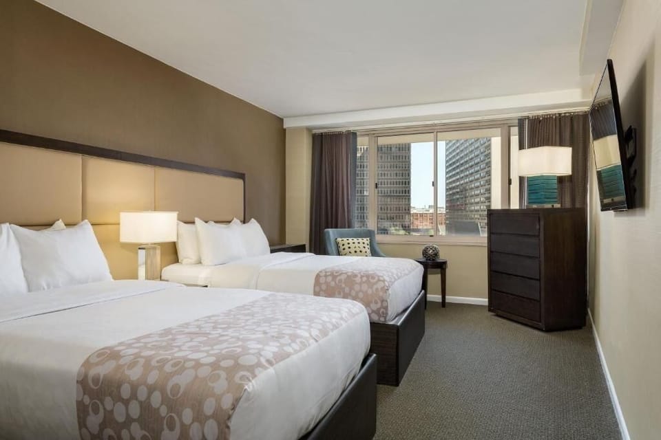 Rest easy in a spacious two-bed room with city outlook.