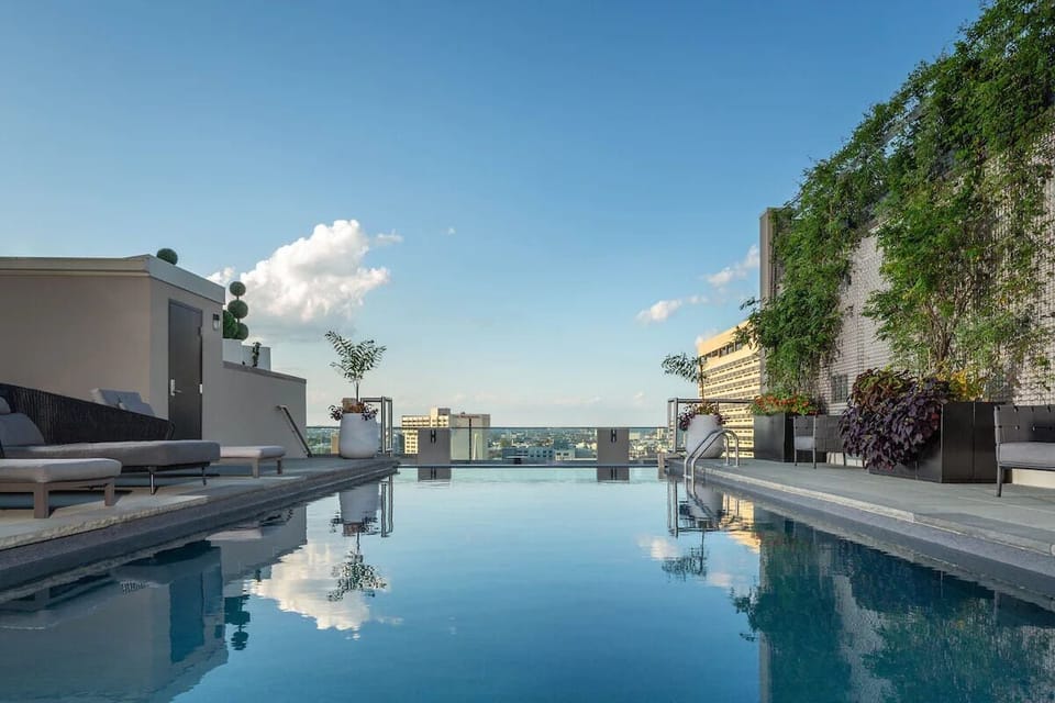 Unwind in the rooftop pool with sweeping city views.