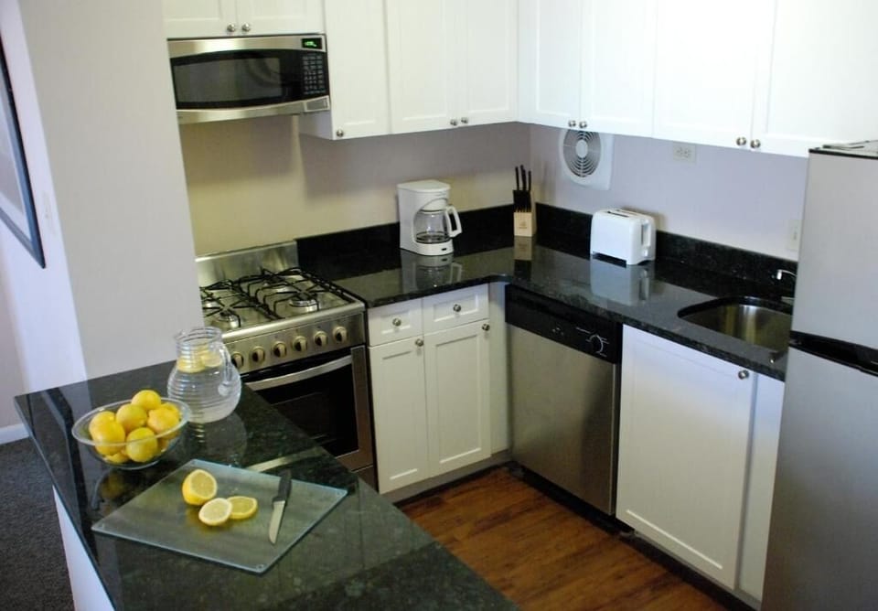 Cook with ease in a fully equipped kitchen with sleek counters.